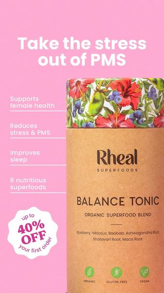 This 9:16 static ad uses a clean, high-contrast pink background to highlight the benefits of a superfood blend for hormonal health.